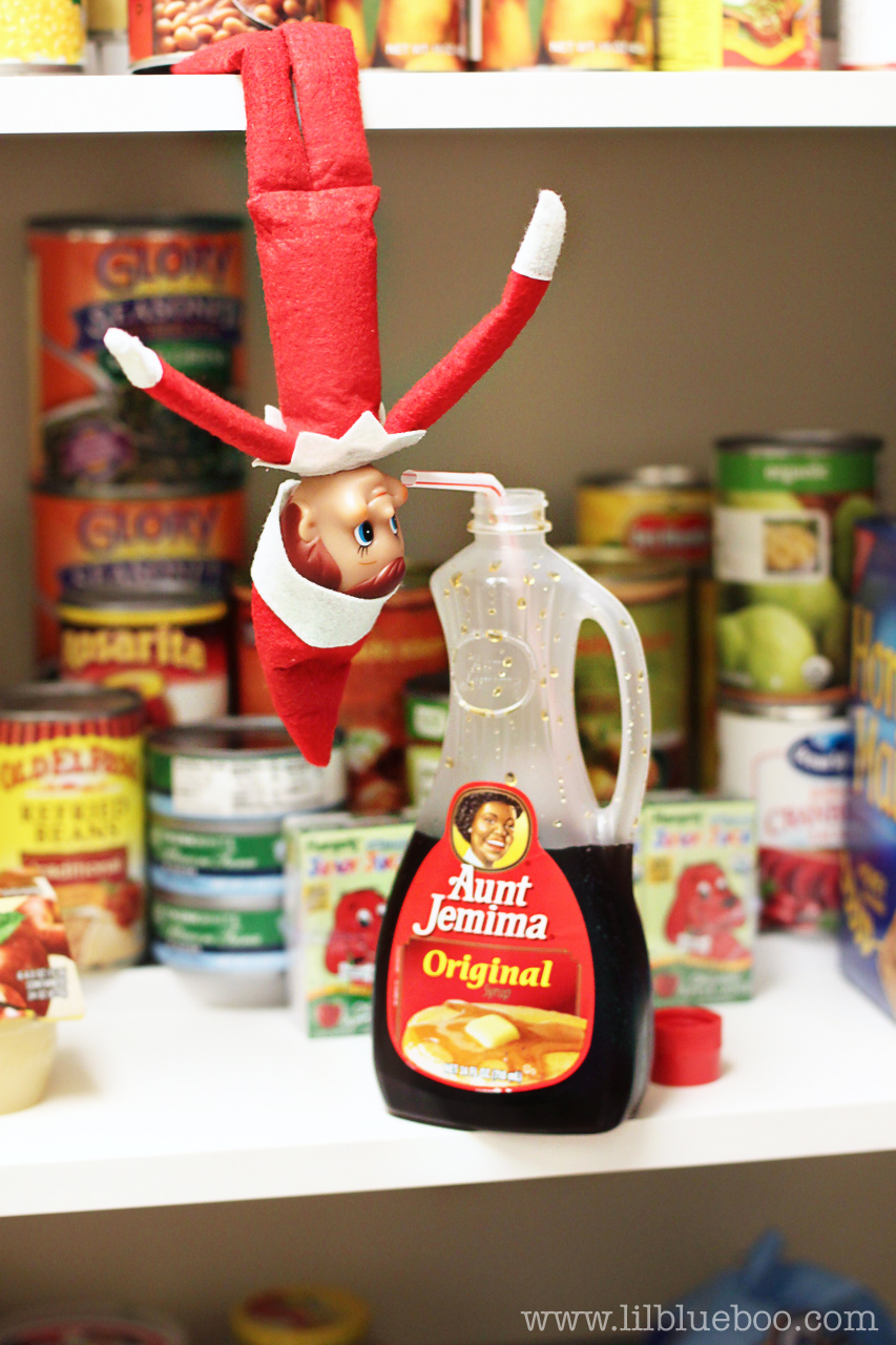 Elf on the Shelf Ideas - Drinking Syrup in Pantry